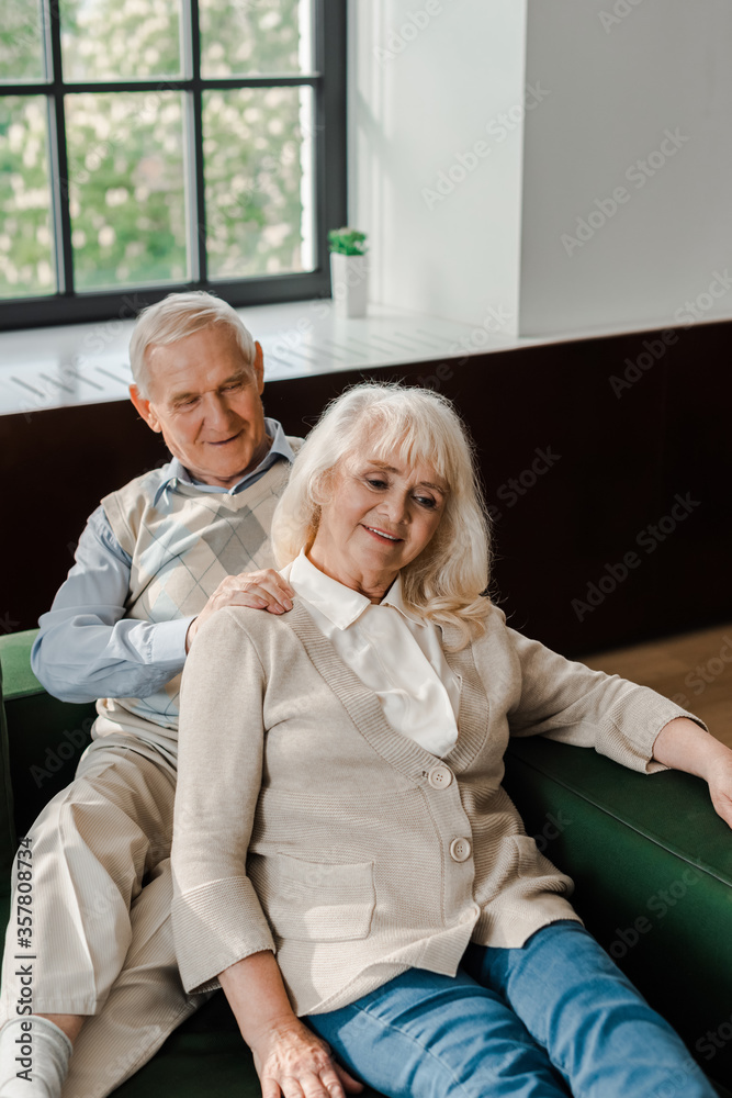 happy senior couple doing massage and resting at home on self isolation happy senior couple doing massage and resting at home on self isolation