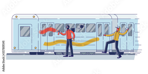 Couple of vandals damaging subway train. Street gangsters and vandalism concept