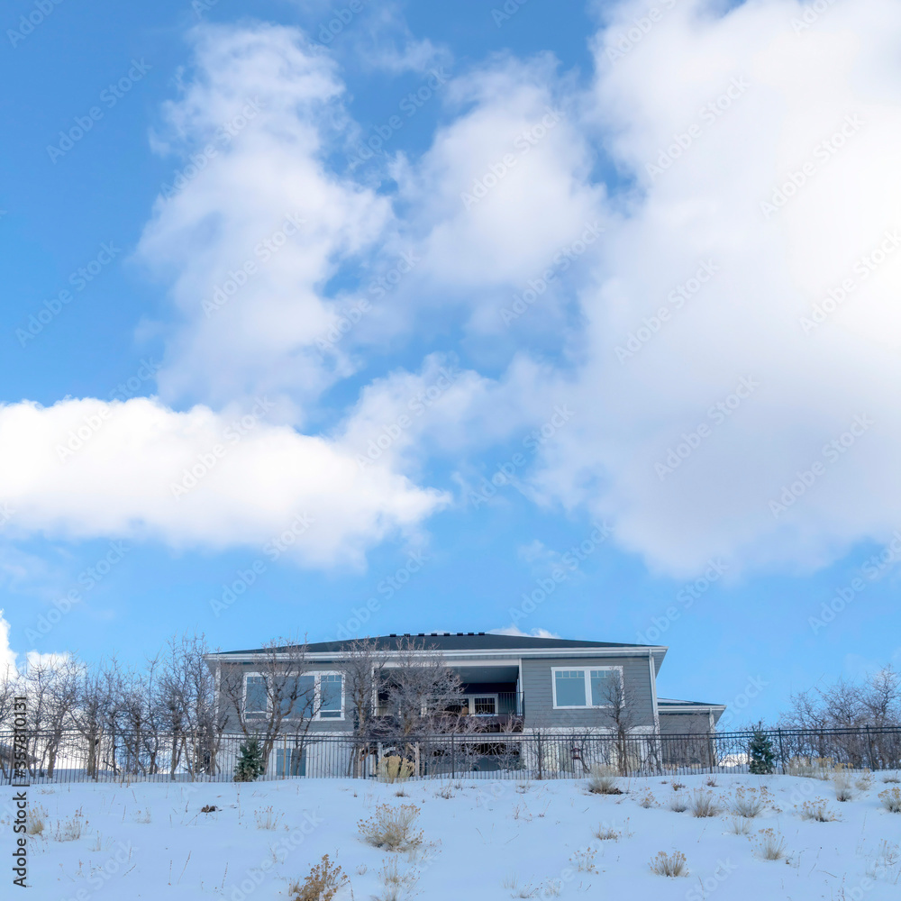 Square crop Home on an incredible mountain location blanketed with fresh snow in winter Square crop Home on an incredible mountain location blanketed with fresh snow in winter