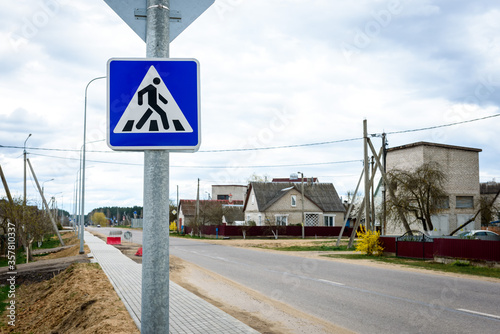 Road signs of pedestrian crossing.