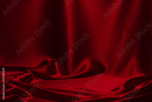 Red silk or satin luxury fabric texture can use as abstract background. photo