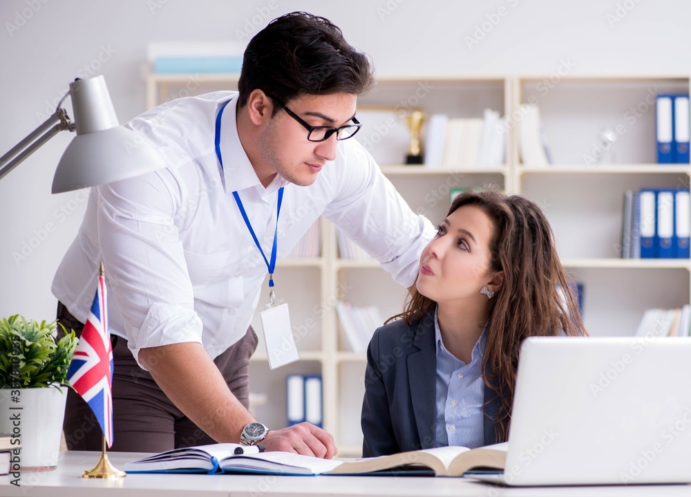 Fototapeta premium Teacher explaining to student at language training