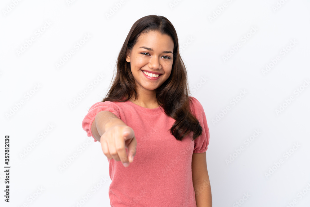Young Colombian girl over isolated white background points finger at you with a confident expression Young Colombian girl over isolated white background points finger at you with a confident expression