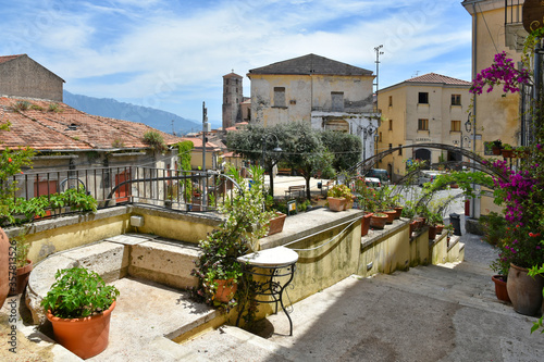 Fototapeta Naklejka Na Ścianę i Meble -  A narrow street between the houses of the medieval town of Eboli in the province of Salerno, Italy.