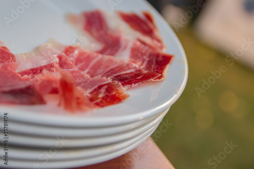 A plate of Iberian ham cut very thin.