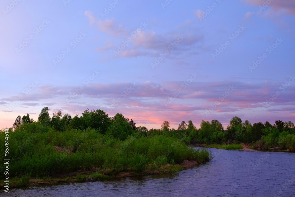 Beautiful crimson sunset over the river.