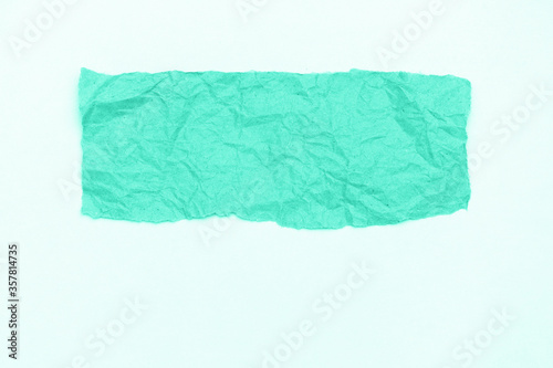 Abstract part of packaging craft wrinkled paper on whitebackground  toned in trendy color of 2020 biscay green