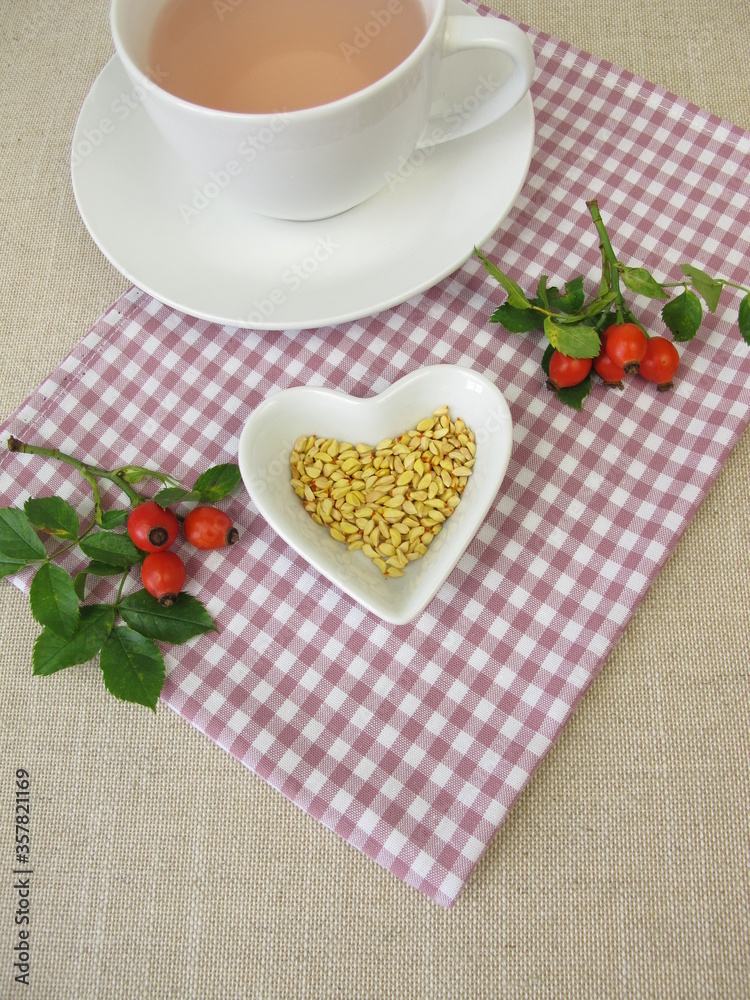 Obraz premium A cup of kernels tea from rose hip seeds