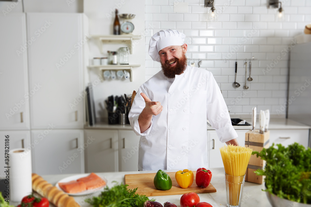 Professional cook cut vegetables in the kitchen