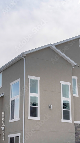 Vertical crop Townhouses exterior with small balconies at the facade in South Jordan Utah