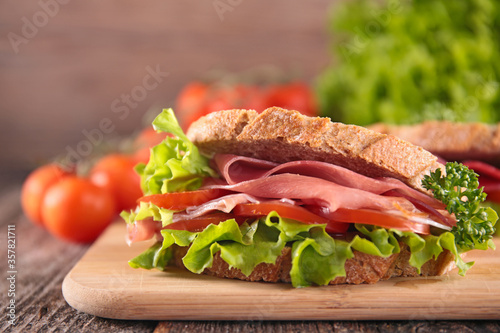 sandwich with ham, tomato and lettuce