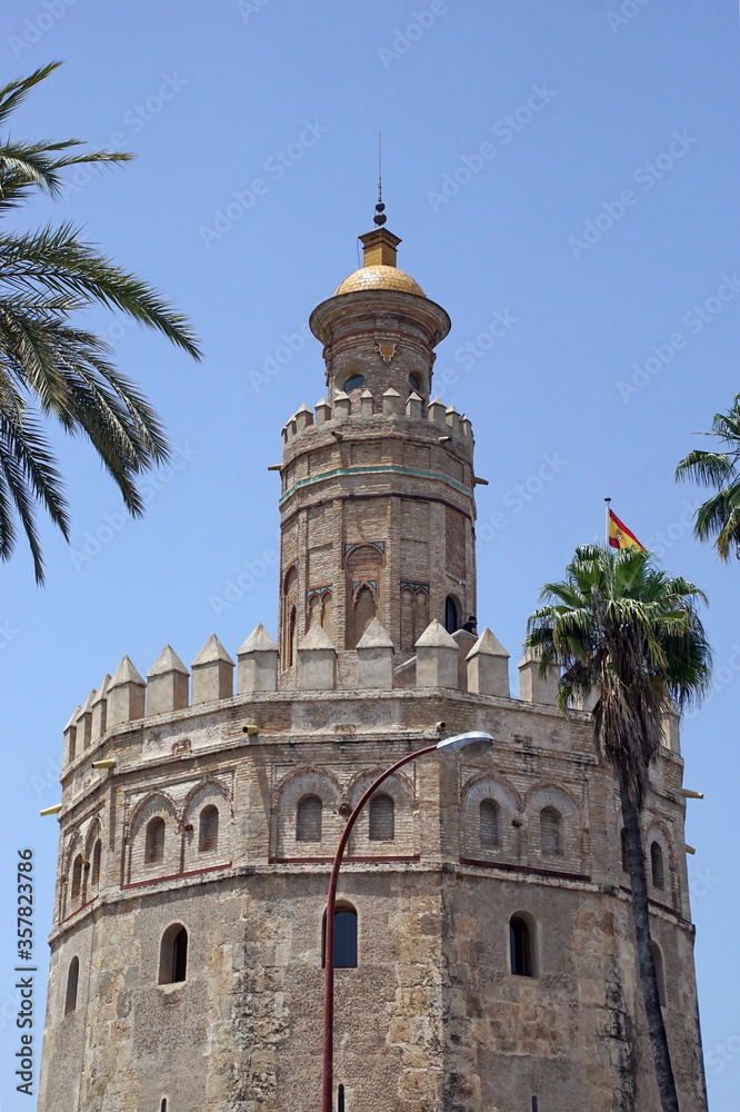 Seville landmark Golden tower of Torre del Oro on the Guadalquivir seafront, Moorish tower, built to protect the harbor of Seville in 1220