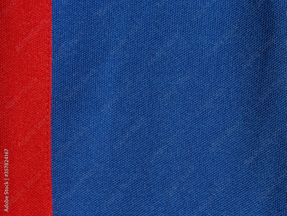 Fototapeta premium The two-colour texture of the synthetic fabric is blue and red. Nylon texture. Embossed synthetic fibre fabric texture.