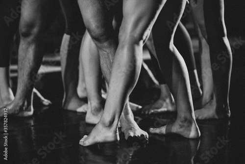 Bare male and female feet. Black and white photography.