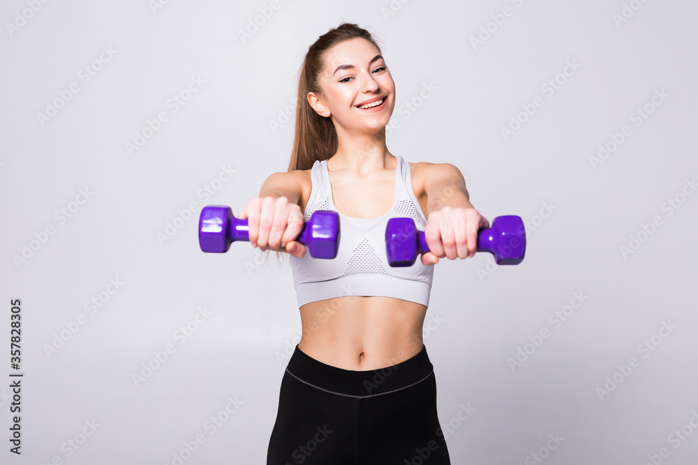 Healthy woman with dumbbells working out isolated on white background. Fitness gym concept Healthy woman with dumbbells working out isolated on white background. Fitness gym concept