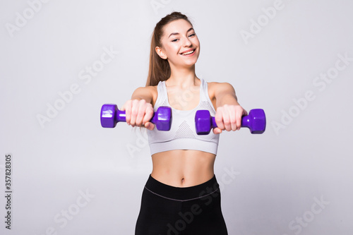 Healthy woman with dumbbells working out isolated on white background. Fitness gym concept