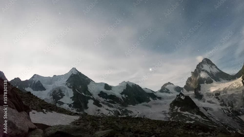 Timelapse video in the mountains: starry night, Moon, sunrise, beautiful day, flying clouds, sunset and magnificent view at Ober Gabelhorn and Dent Blanche Timelapse video in the mountains: starry night, Moon, sunrise, beautiful day, flying clouds, sunset and magnificent view at Ober Gabelhorn and Dent Blanche