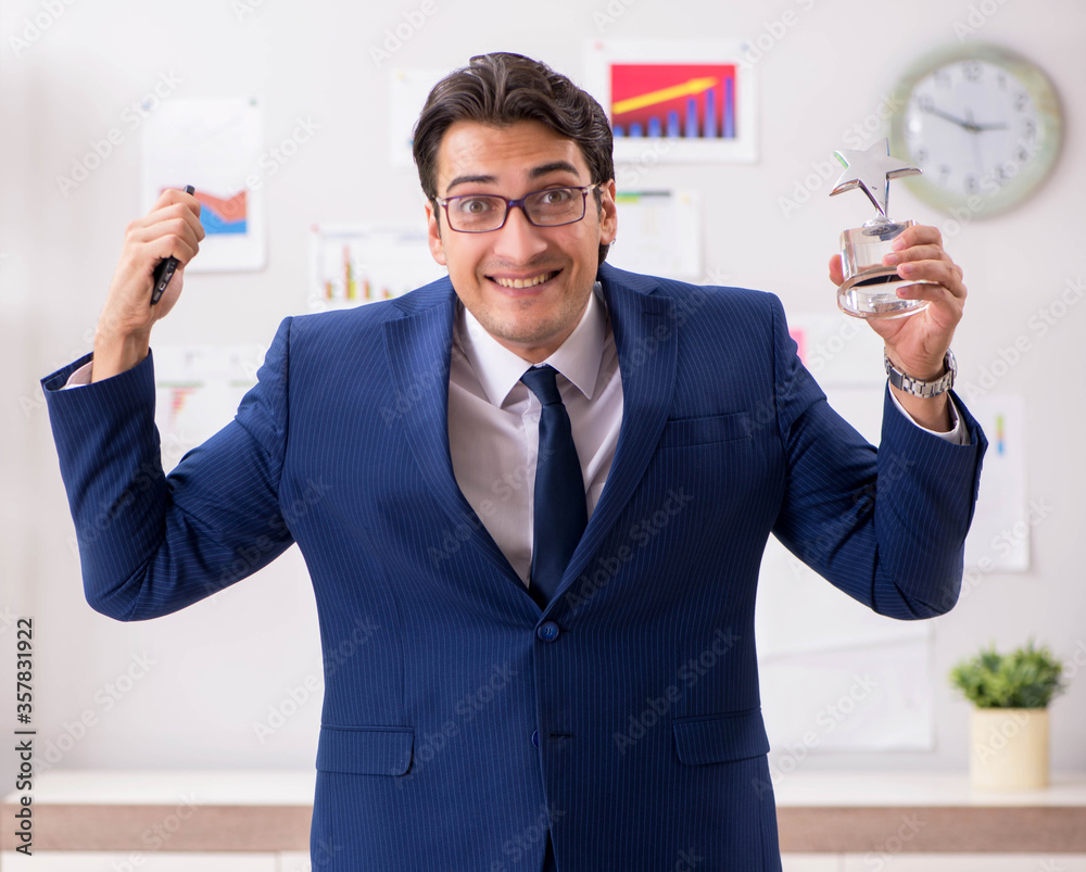 Young handsome sales anayst working at the office Young handsome sales anayst working at the office