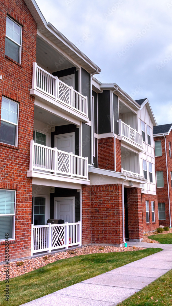 Vertical Modern housing complex with apartments day light