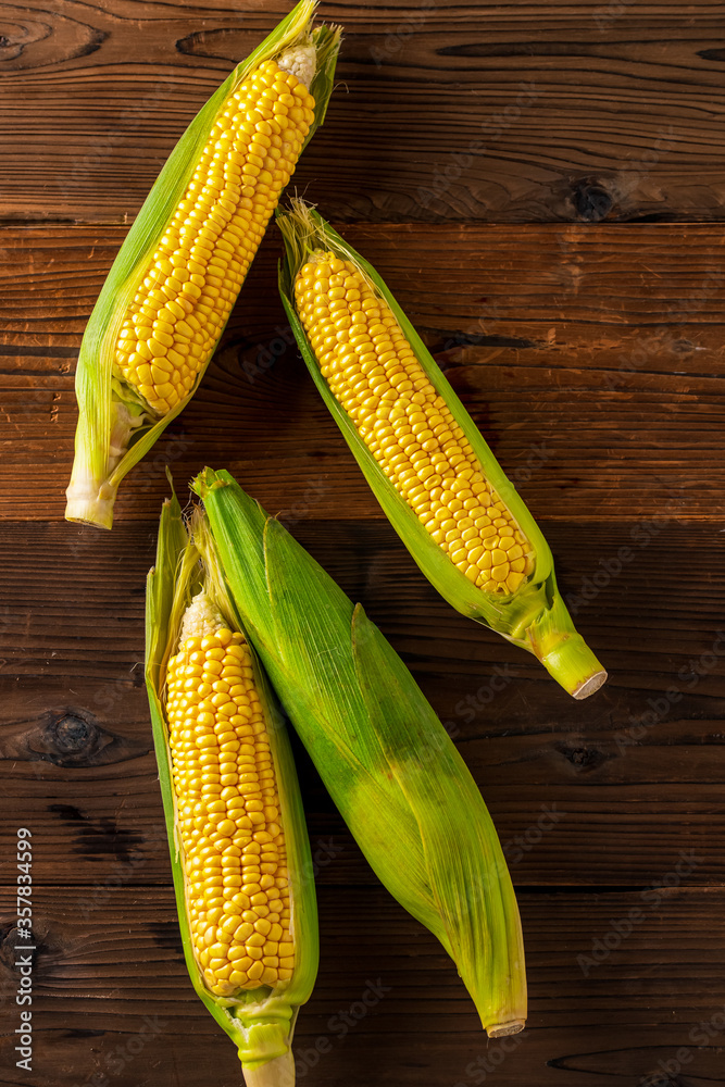 Corn cobs on wood background. Corn cobs on wood background.