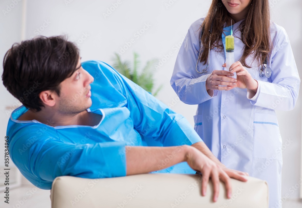 Fototapeta premium Funny man getting ready for buttocks syringe shot