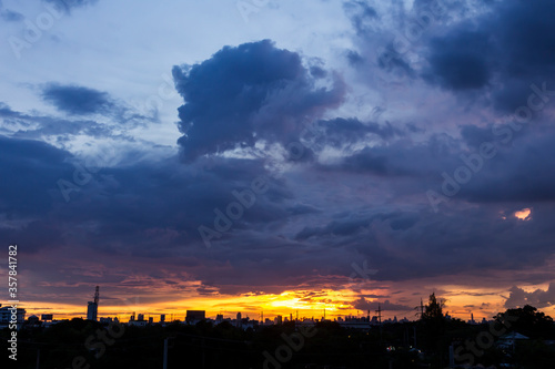 Romantic sunset sky with fluffy clouds © kaewphoto