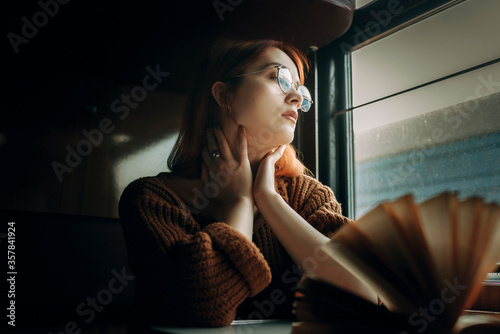 Girl travels in a train carriage