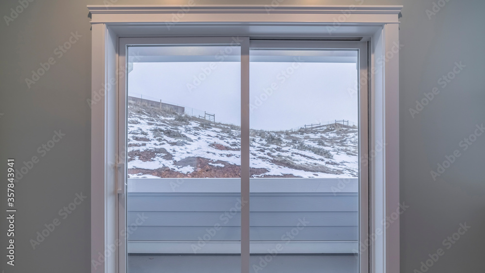 Panorama frame Glass door leading to an external balcony Panorama frame Glass door leading to an external balcony