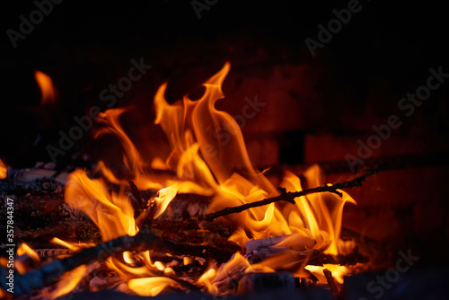 Fire in the hearth burning brightly. Traditional farmhouse fireplace. Natural photo story. Perfect illustration hot for your page magazine