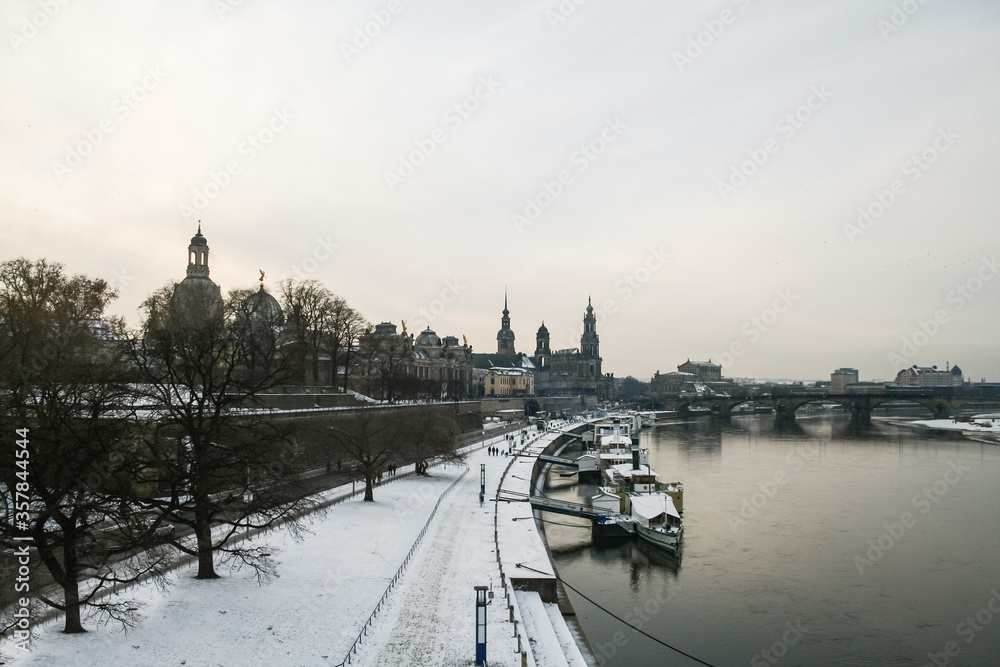 Panorama of the Terrassenufer of Dresden, Germany, in winter, at sunset. Terrassenufer is a major street of the city center of Dresde, on the waterfront riverbank of Elbe river