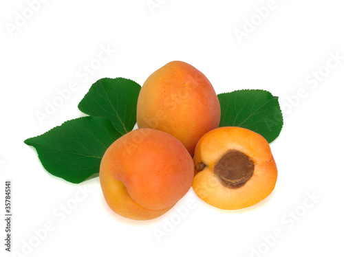 Fresh apricot fruits and leaves isolated on a white background