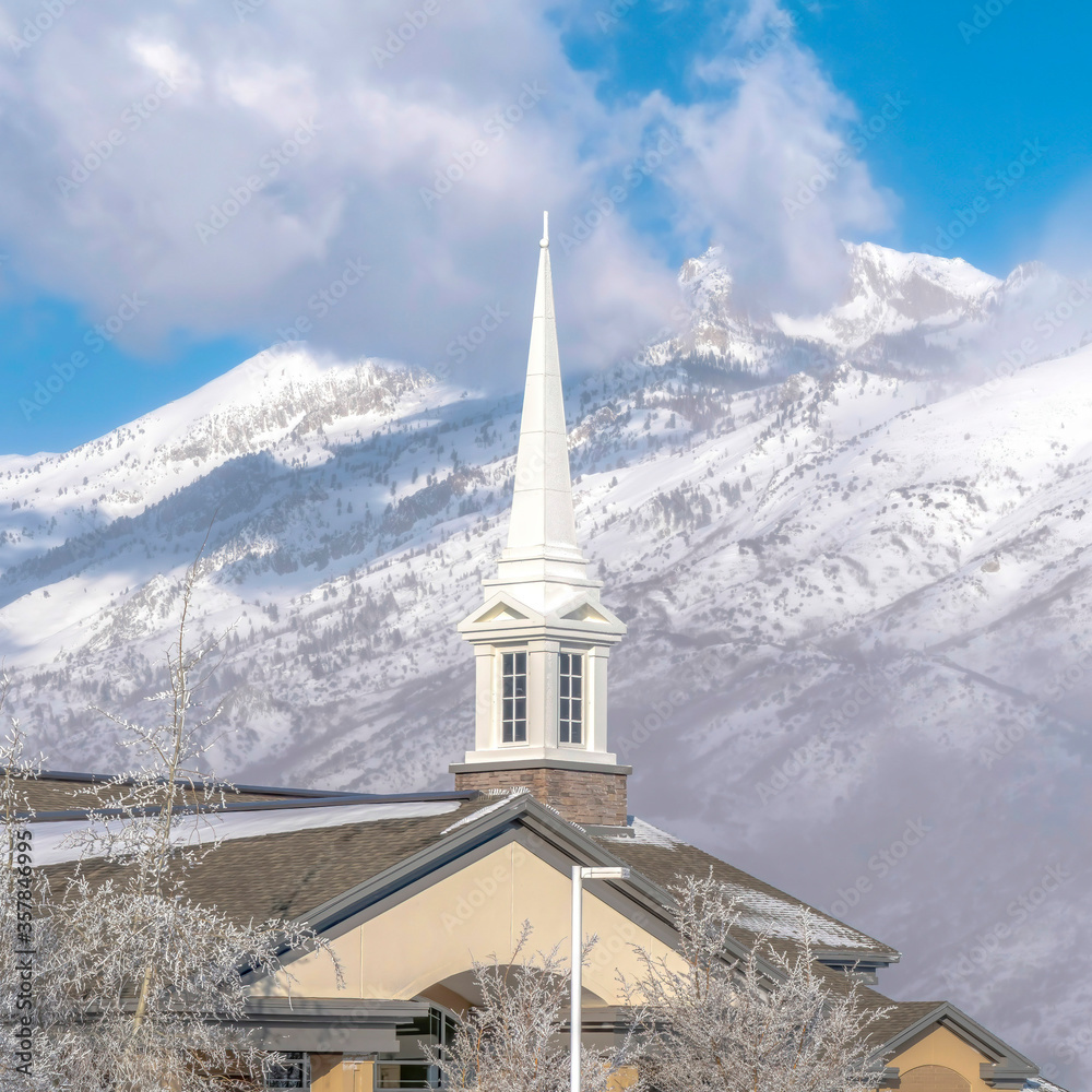 Square frame Magnificent view of snow covered Wasatch Mountain with church in the foreground