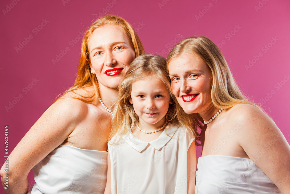 Studio portrait of two women and girl Studio portrait of two women and girl