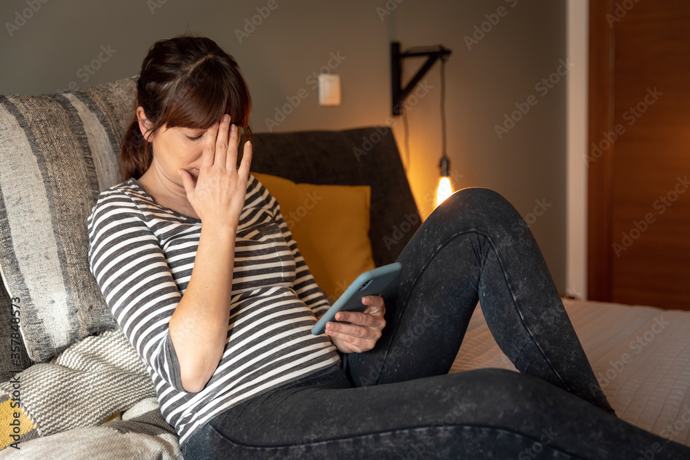 Obraz premium Sad woman at home