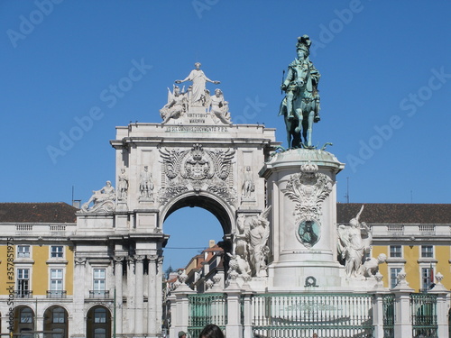 Statue in front of Arch