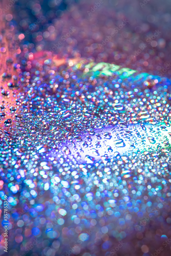 water drops on dvd media, water drops on colorful background water drops on dvd media, water drops on colorful background