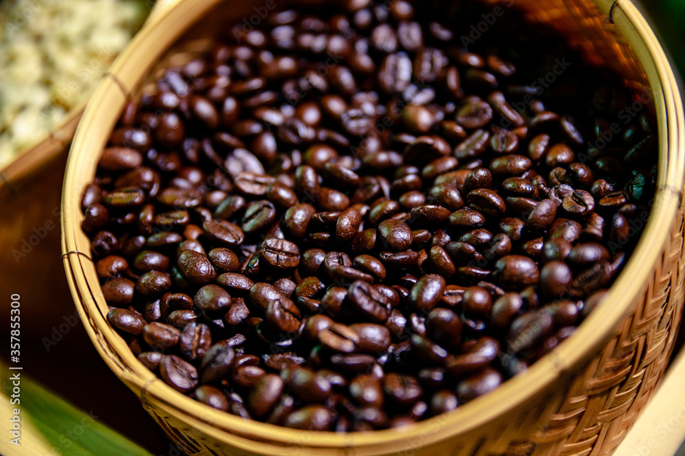 Close up of roasted coffee beans in wicker basket Close up of roasted coffee beans in wicker basket