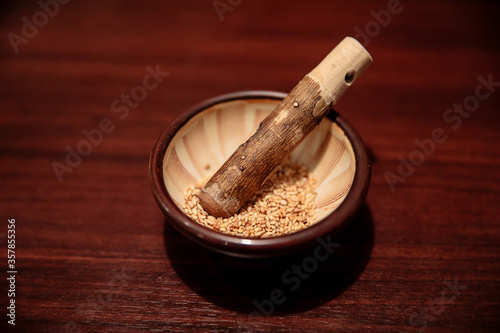Grinding bowl with wooden stick (mortar and pestle) for grind white sesame seeds, Japanese tradition food