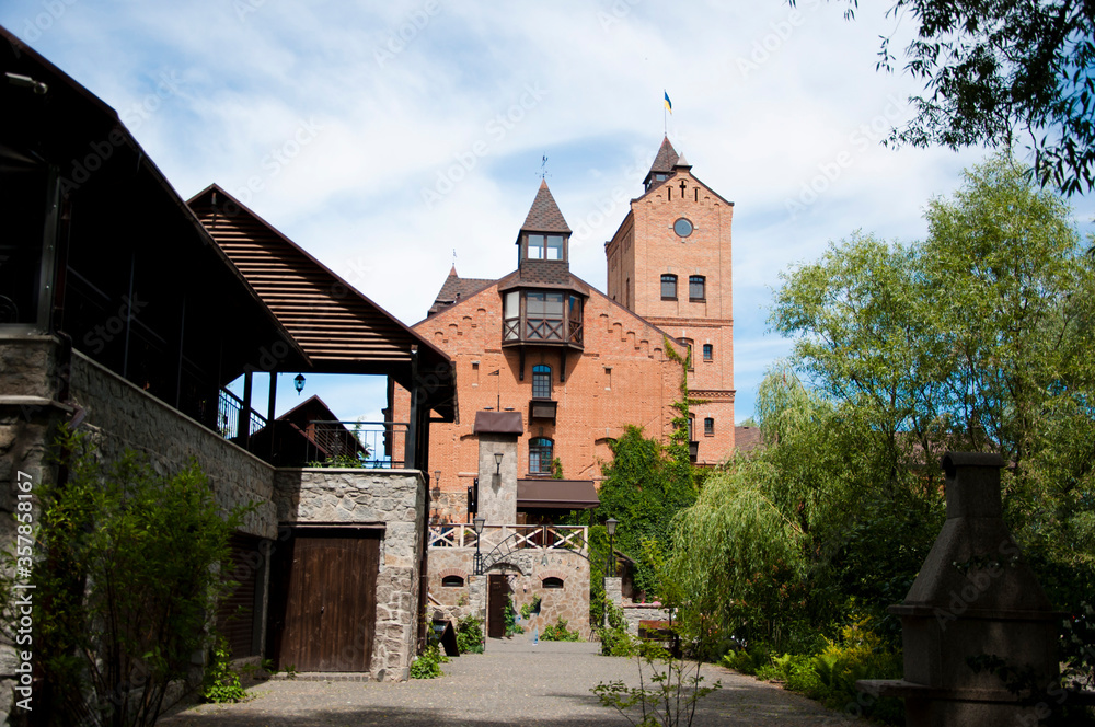 historical cultural complex created in 2007-2011. Stone angel in the foreground. Radomysl Castle, Radomyshl. Ukraine. econstructed fortress in Radomyshl. The ancient castle in the city of Radomyshl