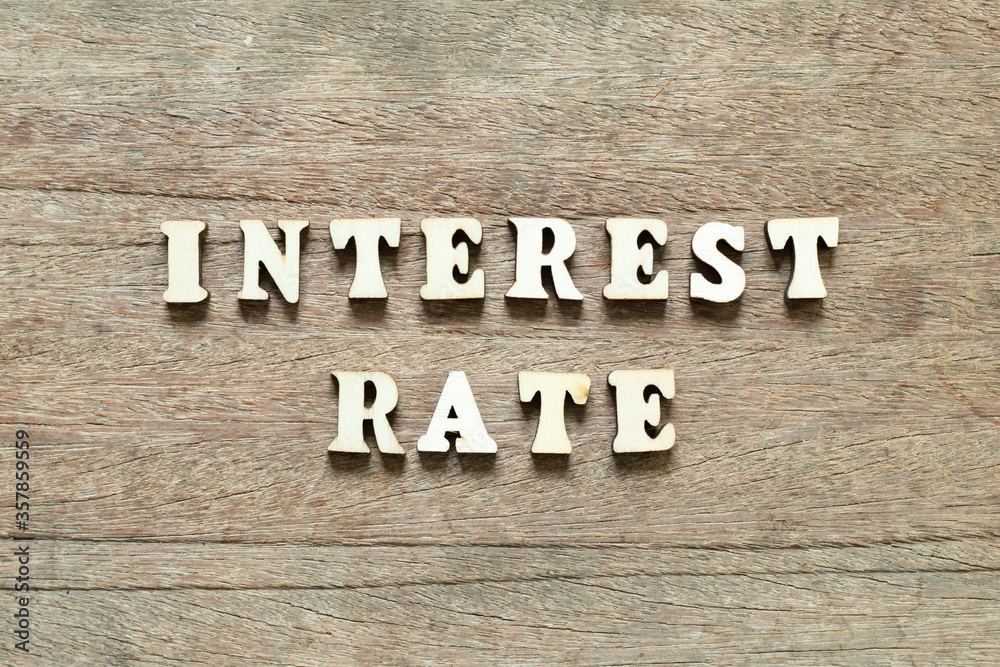 Alphabet letter block in word interest rate on wood background Alphabet letter block in word interest rate on wood background