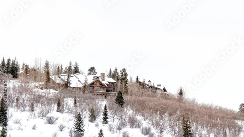 Panorama Mountain top in Park City Utah with homes that sit amid snowy slope in winter