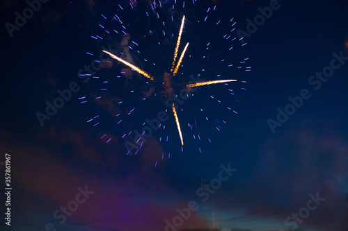 Brightly colorful fireworks 4th July fireworks. Fireworks display on dark sky background.