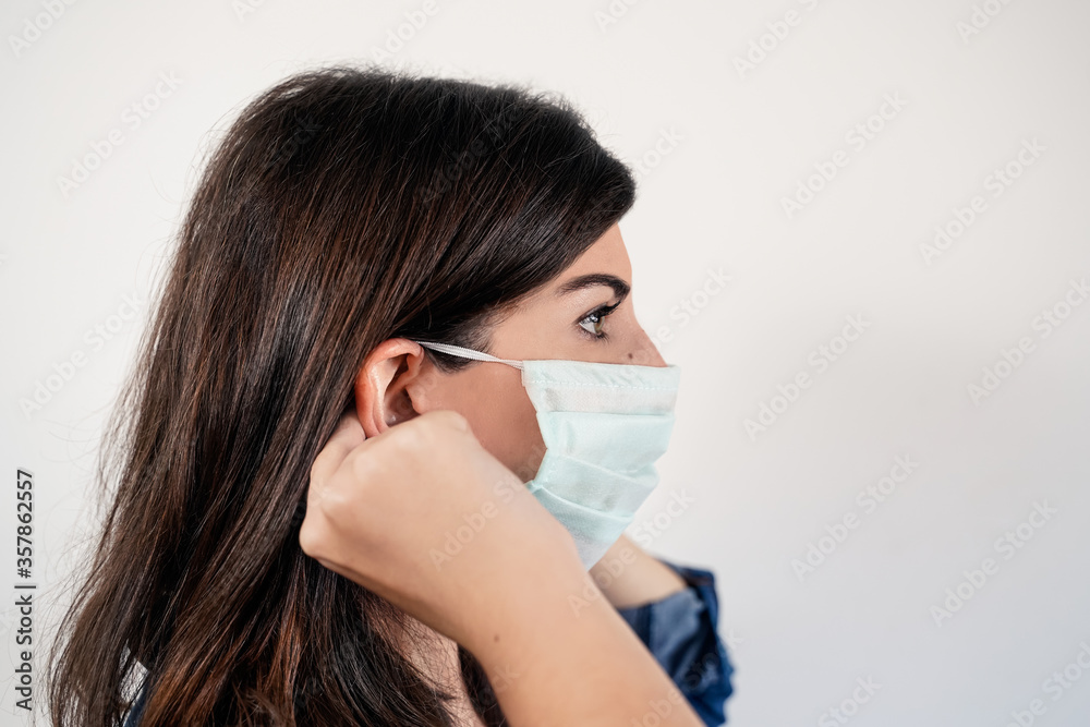 Young woman wearing medical protective mask Young woman wearing medical protective mask