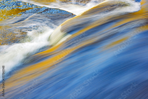 Abstract landscape of the Presque Isle River rapids captured with motion blur, Porcupine Mountains Wilderness State Park, Michigan's Upper Peninsula, USA
