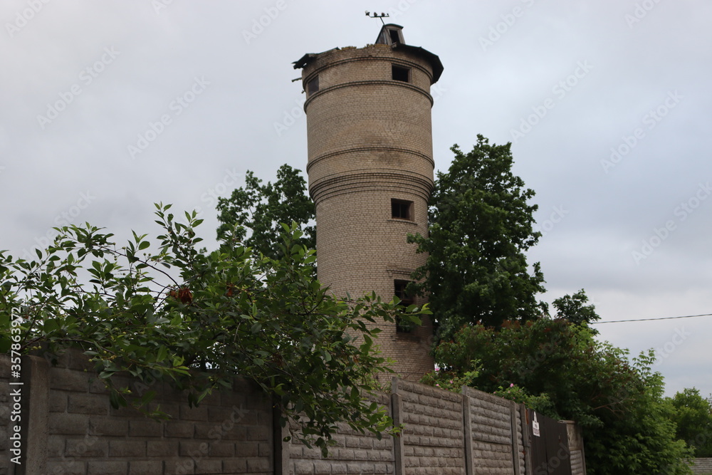 brick water tower building in village