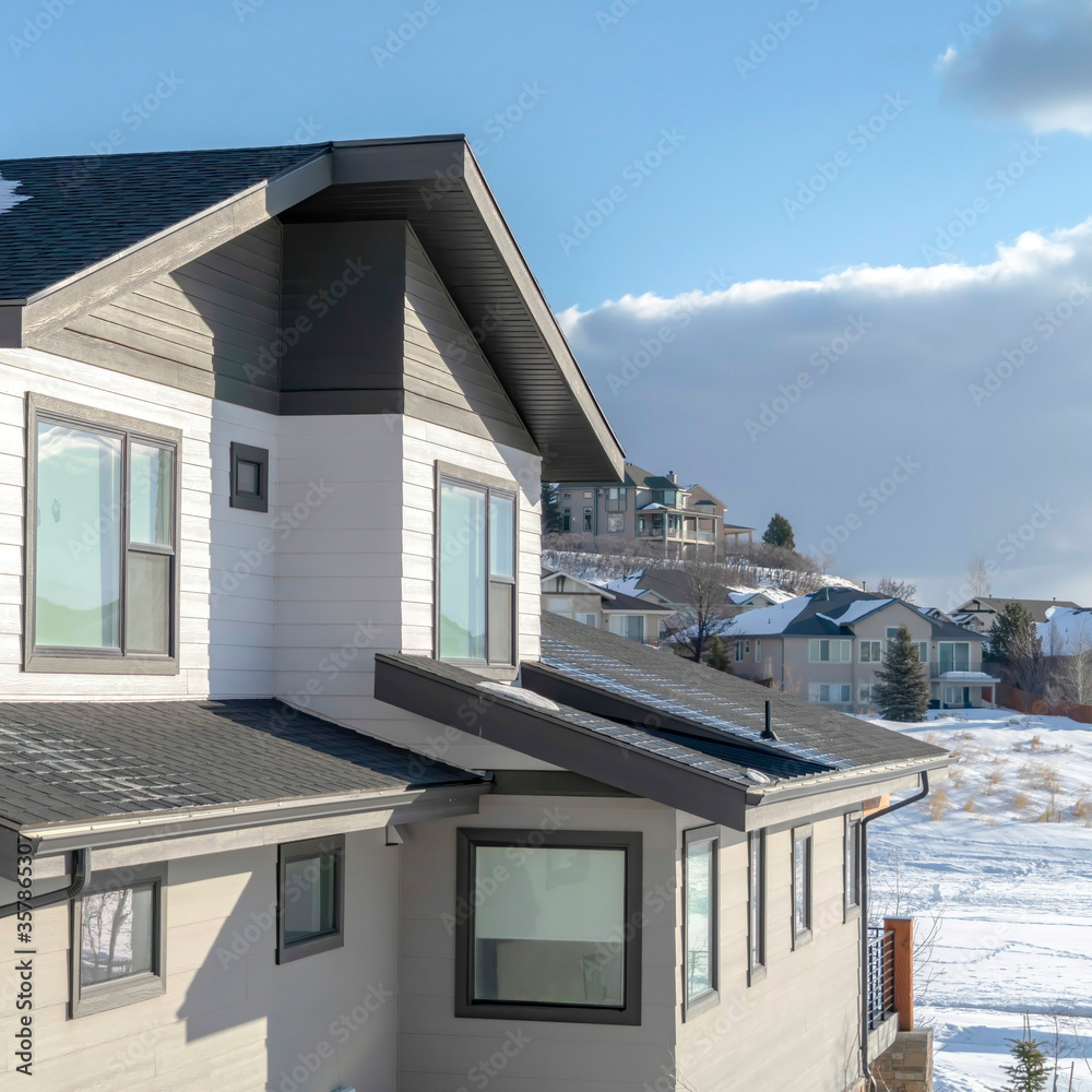 Square Homes with wooden wall siding at the residential community of Wasatch Mountains