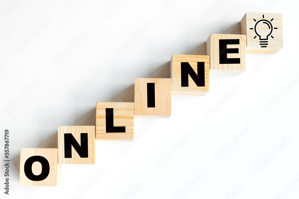 Obraz premium Online-an inscription made of wooden cubes on a white background . Online sale.