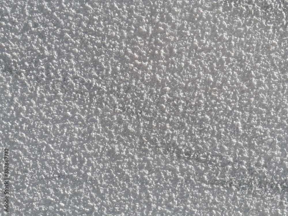 White rough wall texture viewed up close with background