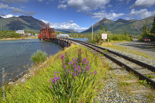 The Iron Rail Bridge of Carcross. Carcross is community in Yukon, Canada, on Bennett Lake and Nares Lake. Carcross is also on the White Pass and Yukon Route railway. photo