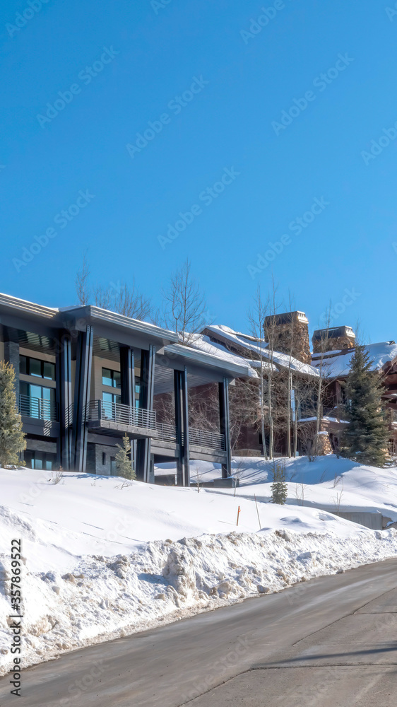 Vertical Road and homes on a luxury neighborhood in snowy Park City Utah in winter